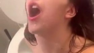 beautiful brunette drinks piss