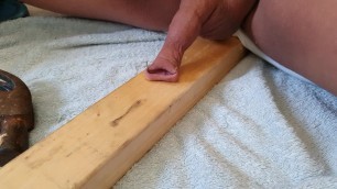 Nailing by foreskin to some wood