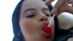 masturbating and licking lollipop