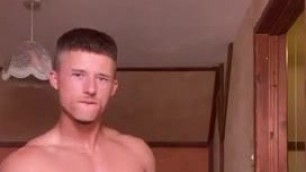 Russian athletic boy posing in his room