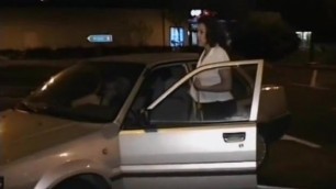 French girl pissing outdoors by a parked car