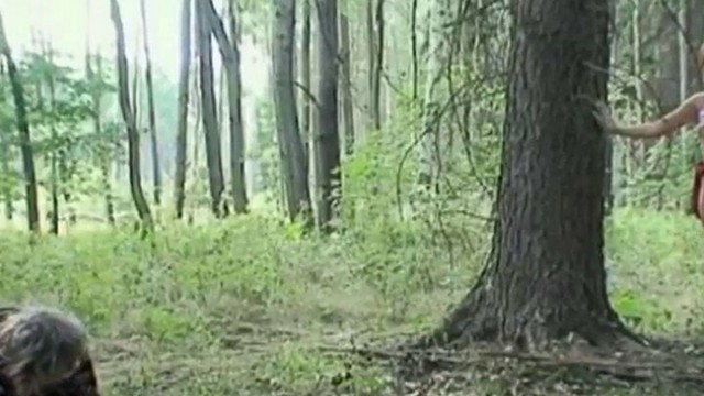The girl looking for mushrooms sees an older lady with big