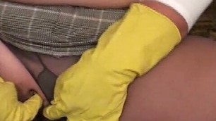 Young busty woman in rubber gloves fingers her soaking pussy