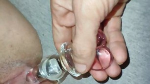 boyfriend jerks my pussy with a glass dildo and caresses my legs and enjoys my beauty