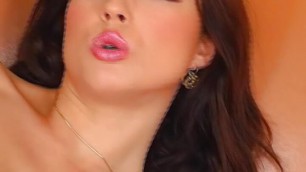 German brunette with huge natural boobs pleasing her shaved muff
